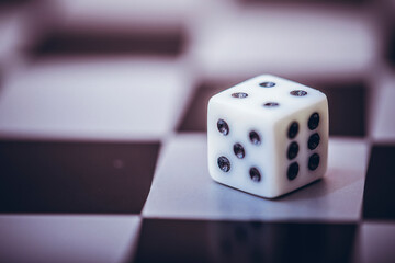 Dice on table, vintage effect. Background for casino games, gambling, luck or randomness. Rolling the dice concept for business risk, chance, good luck or gambling.