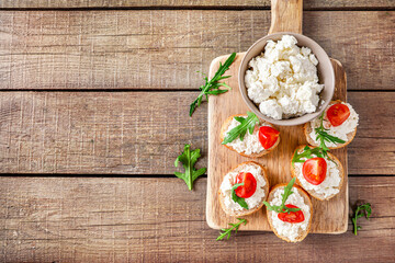 Healthy and tasty snack with bread, tomatoes and cottage cheese