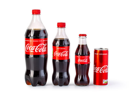 Bottles and can Coca Cola on white background