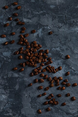 Coffee crumbled on a dark concrete background. Copy space.