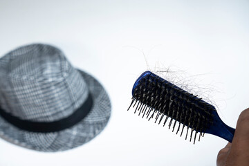 comb dirty with hair loss and hat   isolated on a  white background