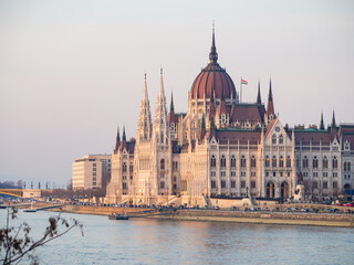 Naklejka na ściany i meble Budapest parliament building at danube river at sunset in spring 