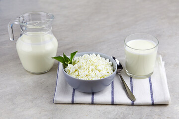 Fresh natural cottage cheese, yogurt or kefir on light background.  Healthy food concept with...