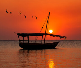 Dhow boat during sunset in Zanzibar.