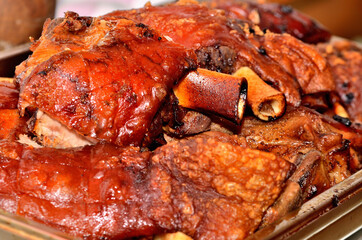 Heap of roasted smoked pork knuckles. BBQ.