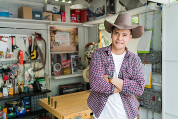 Asian man with a tool room at his house