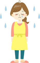 Crying young woman in yellow apron