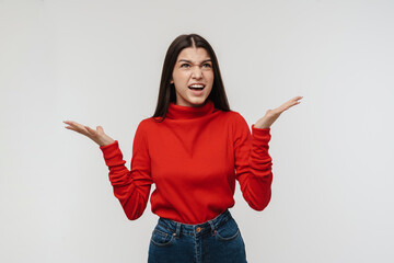 Photo of irritated woman looking upward with throwing up hands