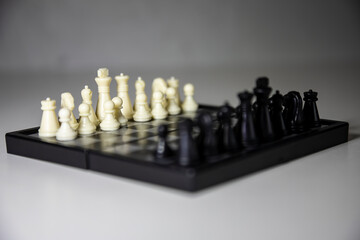 Chess, white and black on the Board, close-up.