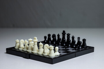 Chess, white and black on the Board, close-up.
