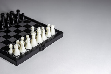 Chess, white and black on the Board, close-up.