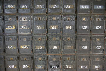 Small, numbered Post Boxes in a wall in Koroit, Victoria, Australia.