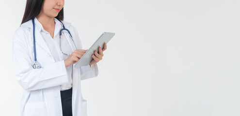 Fototapeta premium Female Doctor or physician holding a tablet for checking patient health in hospital, Concept of online healthcare information and emergency healthcare assistance service, Medical service