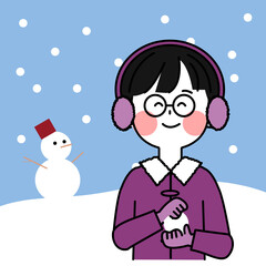 雪だるまの背景と雪で遊ぶ子供