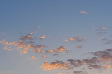 The summer sun at sunset painted the clouds in the sky in unusual colors