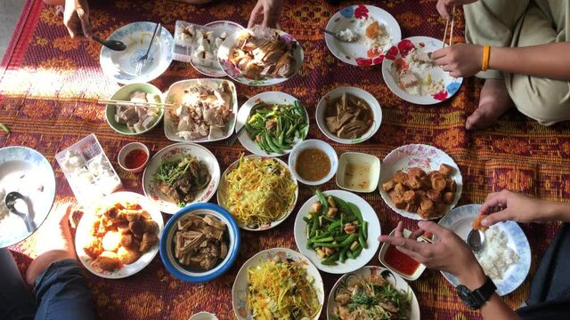 Chinese new year festival concept.Set of Food offerings on chinese new year festival.Group of people in family eating lunch after pray of god,or ancestor worship,top view.