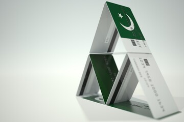 Flag of Pakistan on bank card house, fictional data. Financial instability related 3D rendering