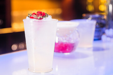 Cocktail with cranberries on the bar
