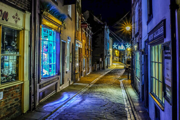 Fototapeta na wymiar Ancient streets of historical old fishing town Whitby, the home of Dracula on the dramatic North Yorkshire coast, fantastic adventure travel destination or holiday vacation to view picturesque scenery