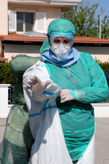 Italian nurses prepare themselves with protective suit, protective masks and gloves to make a swab at home for a possible case of coronavirus covid-19 in Puglia, Italy - 24/04/2020