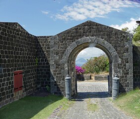 Solid brick walls with an arch gategoing up to the Brimstone Hill Fortress National Park at St....