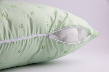 pillow in a cotton cover with a zipper on a white background
