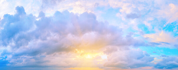 Panorama of sunset sky with bright sun