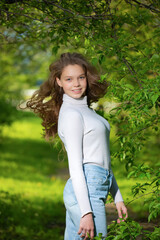 Naklejka premium A young girl turned around on her walk