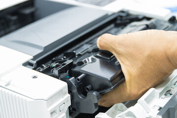 Technicians replacing toner in laser printer concept office supplies repair