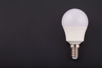 Electric bulb of LED. White on a black background.