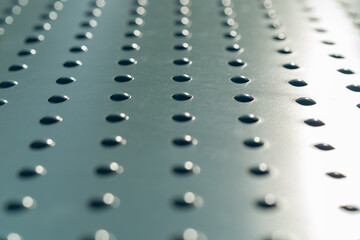 An abstract metal texture with raised bumps