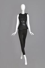 lifeless mannequin with black clothes isolated grey background studio