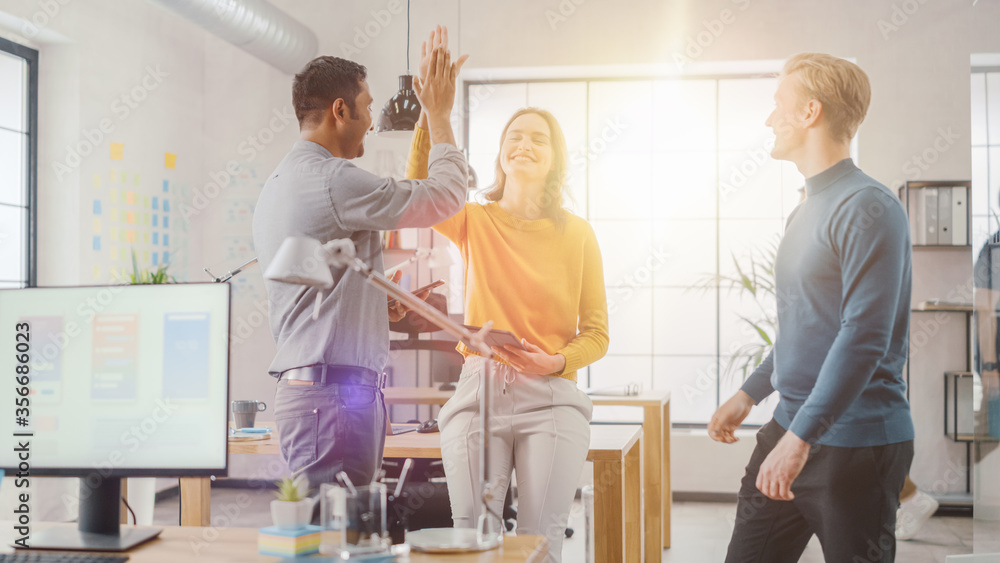 Aufkleber three start-up entrepreneurs celebrate success with high five. they have meeting and discussion abou