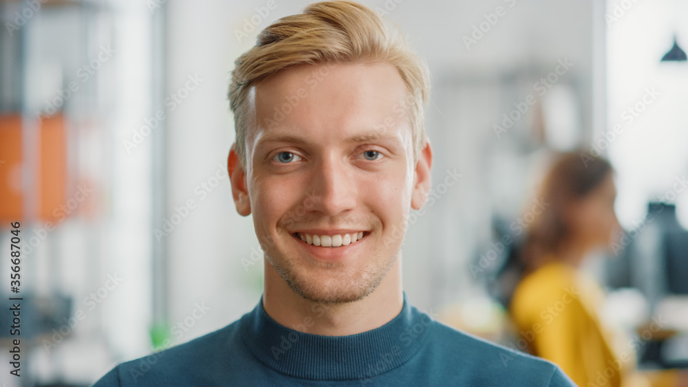 Poster portrait of handsome professional caucasian man looking at the camera and smiling charmingly. succes