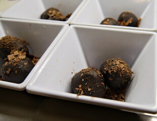 Delicious chocolate crumble balls served in deep white bowls