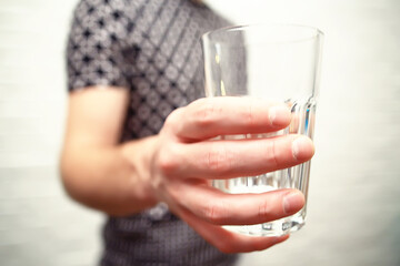 lemonade in glass cafe / fresh lemonade with ice and lime in a glass on a restaurant background