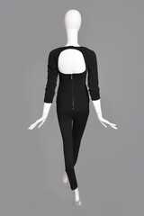 lifeless mannequin with black clothes isolated grey background studio
