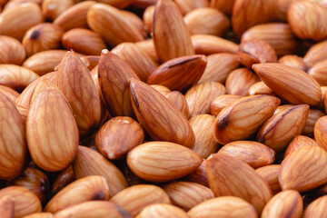 Almond beans soak in water overnight to get the most benefits before  to made almond milk, Health food with good fats and down aging, Antioxidants and lower cholesterol levels, Selective focus.