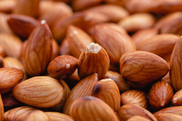 Almond beans soak in water overnight to get the most benefits before  to made almond milk, Health food with good fats and down aging, Antioxidants and lower cholesterol levels, Selective focus.