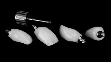 dental screwdriver for fixing four dental crowns, shot in black and white style