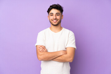 Arabian handsome man over isolated background keeping the arms crossed in frontal position