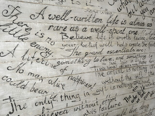 quotes on a white wooden wall