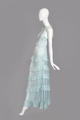 lifeless mannequin with blue clothes isolated grey background studio