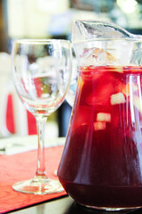 Glass and jar of sangria