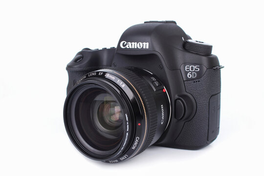 BANGKOK, THAILAND - September 19,2018 :  Canon Eos 6D DSLR camera with EF 28 mm F1.8 IS USM Lens on white background , Canon is a popular brand from around the world.