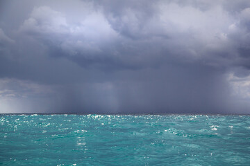Sunny Adriatic Sea waters waiting for stormy weather; Dark dangerous clouds and Sea landscape.  The calm before the storm.