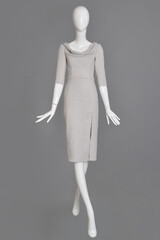 lifeless mannequin with blue beach dress isolated grey background studio