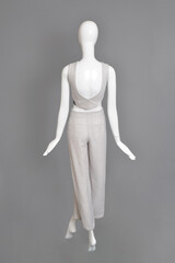 lifeless mannequin with blue beach dress isolated grey background studio