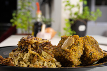 Mjadra, Mujaddara and kibbeh. Rice with lentil.