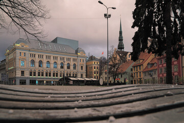View to the empty Līvu Square and Riga Russian Drama Theatre in the Old Town of Riga in sunset....